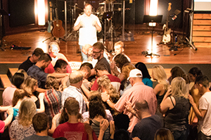 Group prayer at Cornerstone