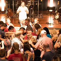 Group prayer at Cornerstone